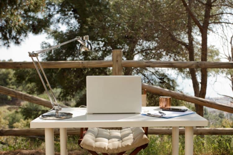 Computer in an ideal bucolic setting for remote work and D8 visa for digital nomads.