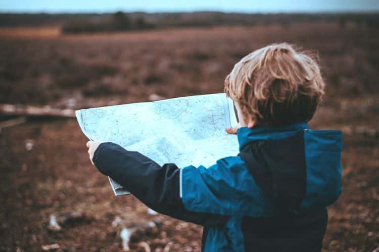 Child looks at map to move to Portugal